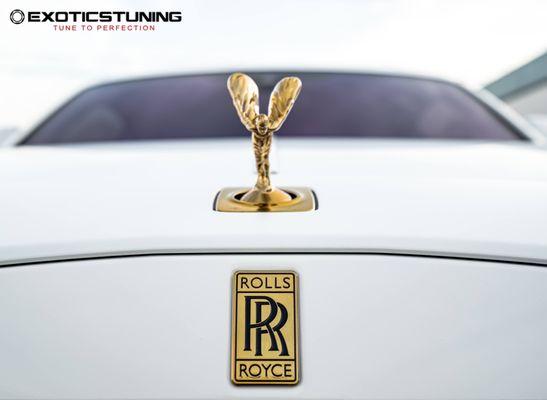 Rolls Royce Wraith custom wrap with gold accents, Forgiato wheels with custom matching calipers.