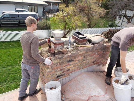 Taking down a rotten chimney chase.