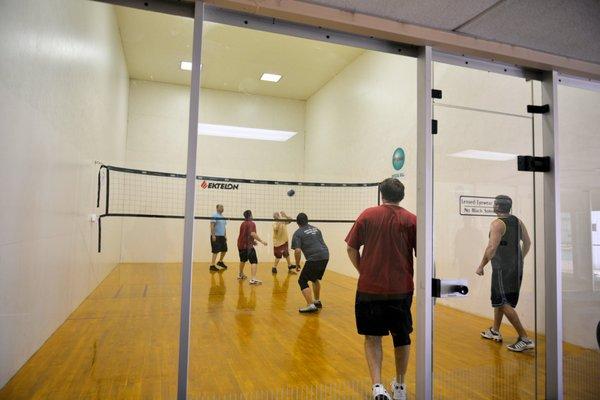 Members having fun in one of our four racquetball/volleyball courts.