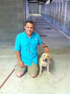 Wade in kennel with "Koda".