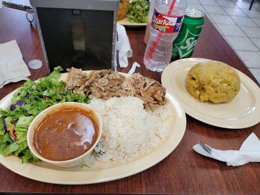 Pernil, mofongo with beans and rice.