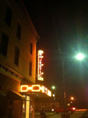 Downtown theatre lit up at night.