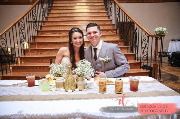 Head table set in front of grand staircase