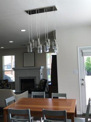 Moved our electrical to the center & Installed new fixture over our dining table.