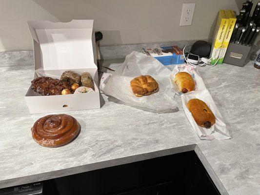 2 sausage rolls, one egg, sausage, cheese croissant, 2 blueberry cake, one sprinkle , one cinnamon roll, one apple fritter for $14.37.