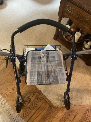 Tried to open up and lay flat on mothers walker to see if possible she can enjoy reading the daily news.