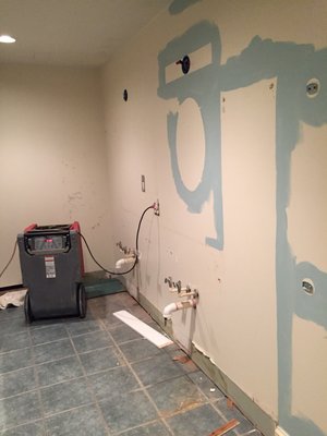 They initially painted around mirrors hanging on the wall & with damaged vanities in place (blue is new).