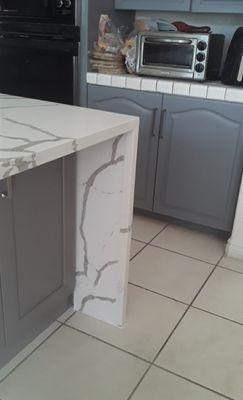 Quartz-Calacatta white 52" wide Island with both sides waterfall finished.