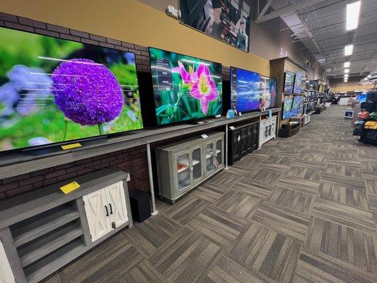 Wall of demo TVs available at Electronic Express