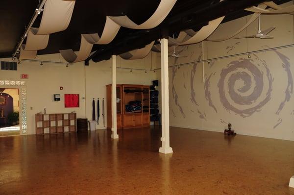 Our spacious, 1800 sq ft yoga studio with cork floors