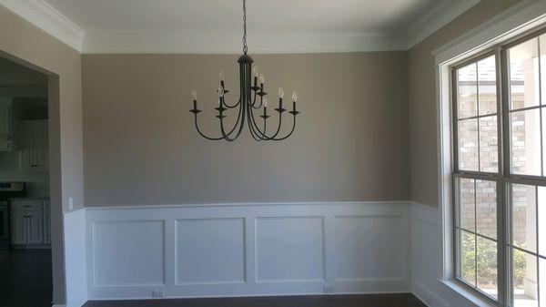 Dining room with wainscoting which is an included feature