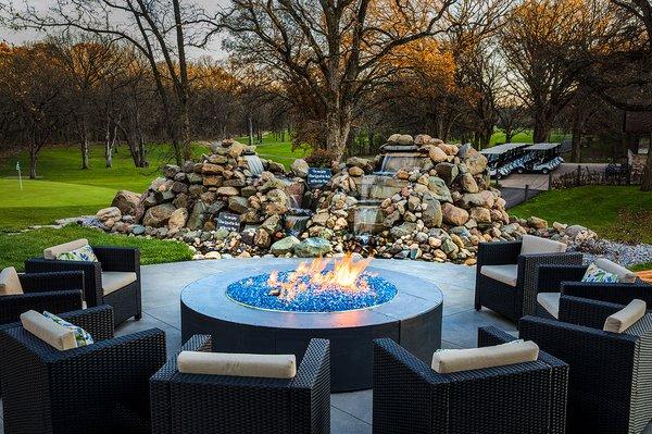 Our outdoor patio featuring the fire table and waterfall.