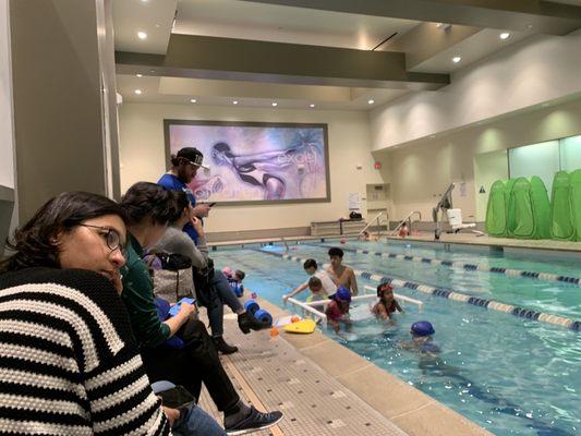 The minimal parent seating area so close to pool you're subject to getting wet by splashing kicks.