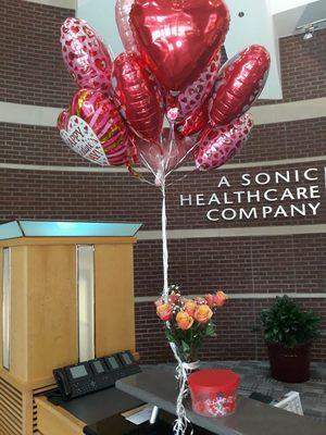 Valentine's day package order Dozen roses, balloons and chocolate covered strawberries.