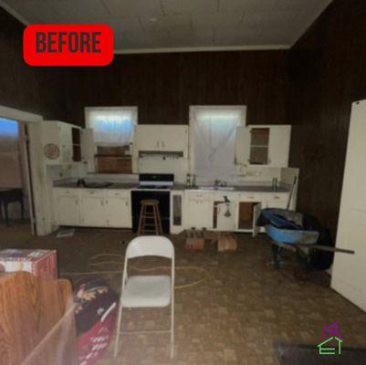 This is the before photo of a kitchen renovation. We added new drywall, cabinets flooring, and paint to recreate this space.