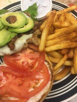 Grilled chicken sandwich with bacon and avocado. Fries are seasoned perfectly!