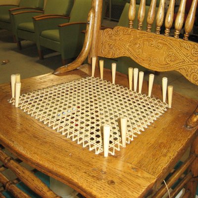 The SAGE Furniture Restoration Workshop has earned a reputation for its fine reweaving of cane chairs.