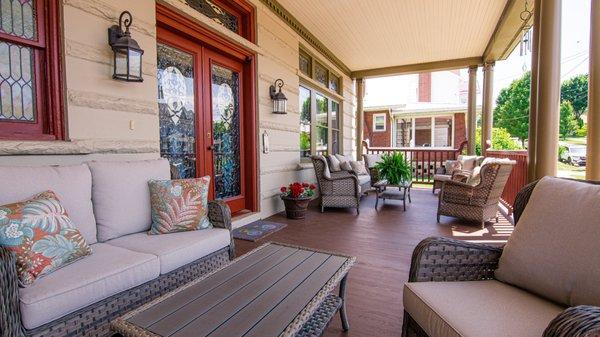 Picture yourself on this amazing front porch. . . with a beverage of course!