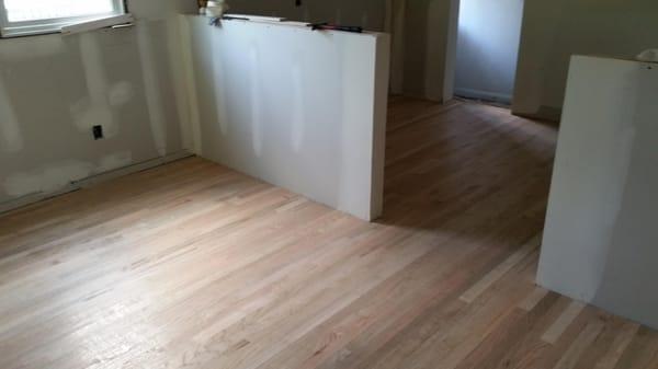 An install we did in a kitchen and dining room adjacent to an existing wood floor.