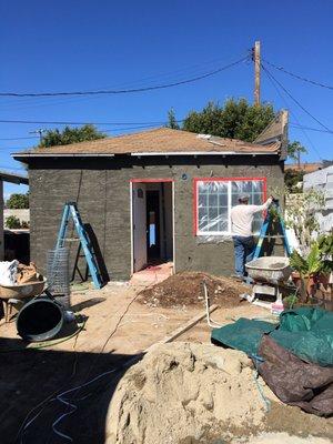 Stucco finishes to the new garage/ back house