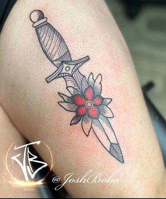 Upper thigh tattoo