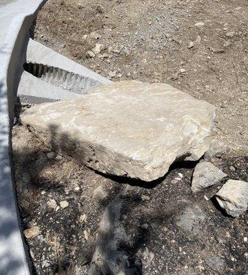 Rock left in ditch!