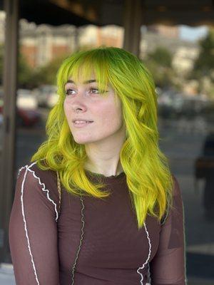 Green to yellow colormelt + balayage on a textured shag