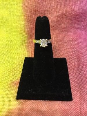 Size 6, 14 karat gold, oval shape 1.25 carat diamond...