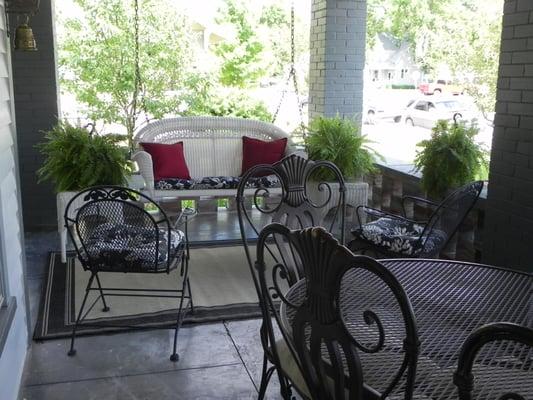 Wrap around front porch with a porch swing, table for summer breakfasts, and a peaceful place to enjoy conversation.