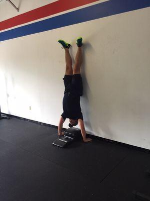 One of our athletes doing handstand push-ups in a workout for the first time!