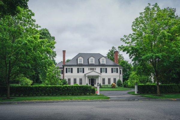 This  grand 3 -story home stands as a beacon of elegance and luxury.