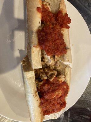 Chicken cheesesteak with onions and sauce