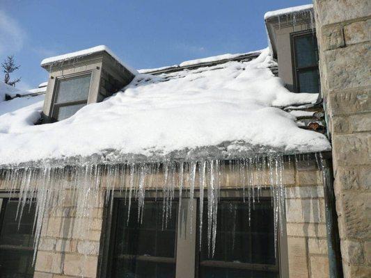 The dreaded Ice Dam is caused by heat loss through your roof.