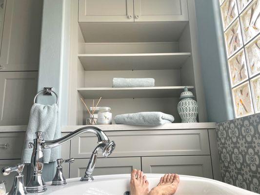 Freestanding tub, shelving with storage