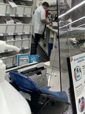 This is a Pharmacy worker from Paris Tn Walgreens standing with his foot in a drawer(which medical supplies are suppose to go)