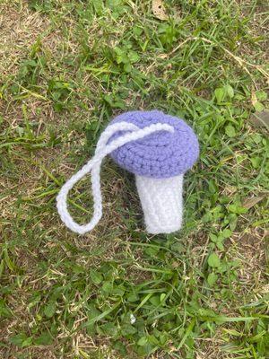 Small purple and white crochet mushroom