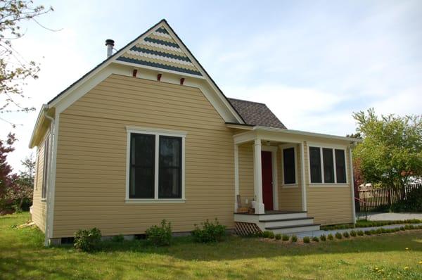 New foundation, windows and siding with an uplifting paint scheme welcomes people into Coupeville while touring  Ebey's Landi...