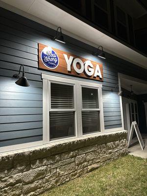 Our sign looks awesome at night! I love the metal letters on the wood background.