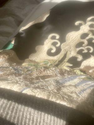 Loose threads on embroidery following dry cleaning