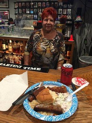 Our wonderful bartender, Erma made homemade ribs , coleslaw , dinner roll, brawster sausage? and rice.