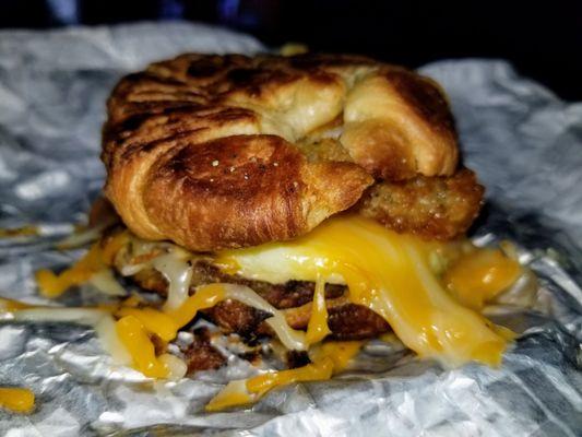 Custom croissant breakfast sammy. Sausage, egg, cheese, bacon, hash brown.