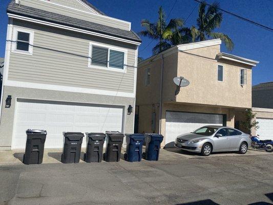 Owner Real Estate Broker leases to sober living business & tenants trash cans blocking neighbor's garage door. Owner is disrespectful!