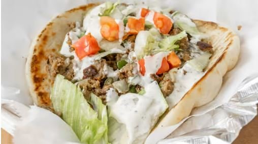 Lamb Gyro:
Grilled Lamb and Salad in toasted pita topped with homemade Taziki sauce (White Sauce)