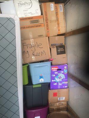 Boxes and totes stacked to the ceiling