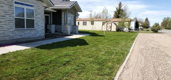 Installed sprinklers, curbing, rock ,sod, trees, bushes