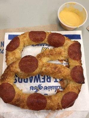 Pepperoni pretzel and cheese sauce