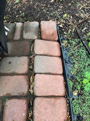 Edge failure. Turns out when you lay a patio on a bed of mulch it doesn't last. Believe it or not, it looks worse in person!