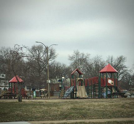 The playground is near busy Broadway and unfenced.