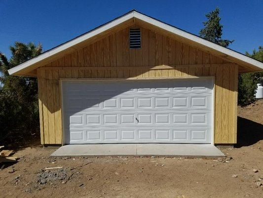 Detached garage with outside keylock for garage door.