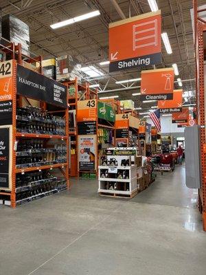 Middle aisle of the store showing Hampton Bay Solar Spot Lights and other items in the middle